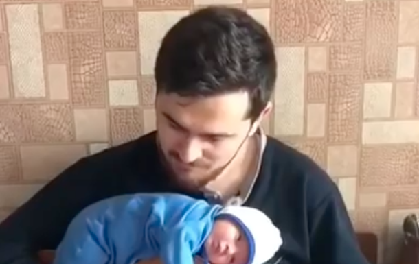 Baby Lies on Top of Guitar While Dad Plays
