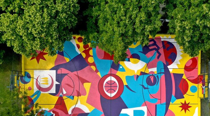 Street Artist Paints A Basketball Court With Bright Colors
