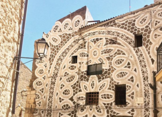 Artist Decorates Buildings With Lace Murals