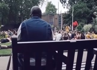 A Park Full of People Joins a Man Singing “Livin’ on a Prayer”